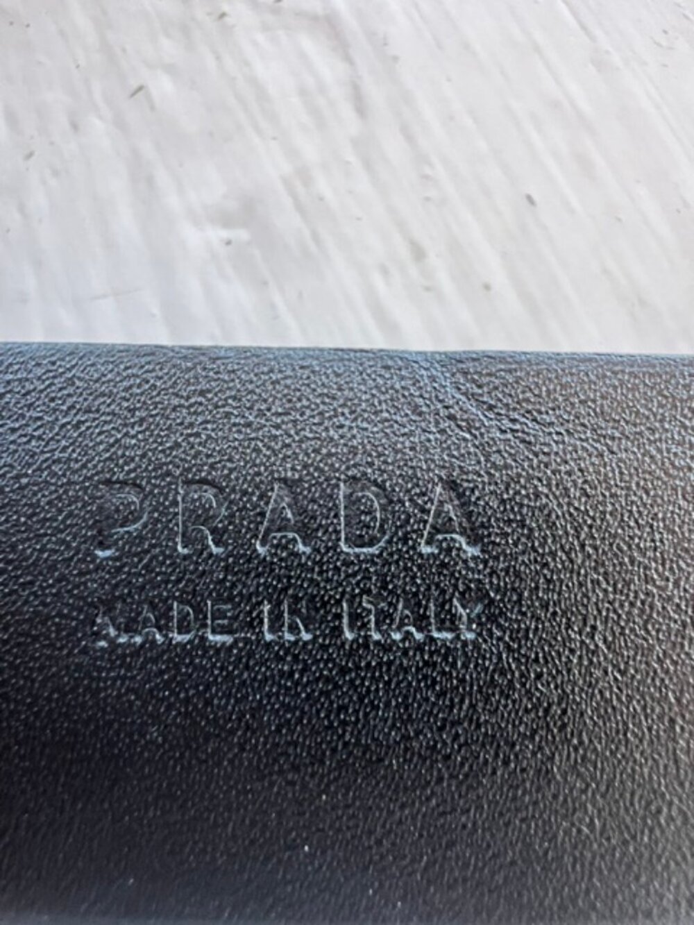 Authentic Prada black leather men’s belt with classic silver-tone buckle. Italy